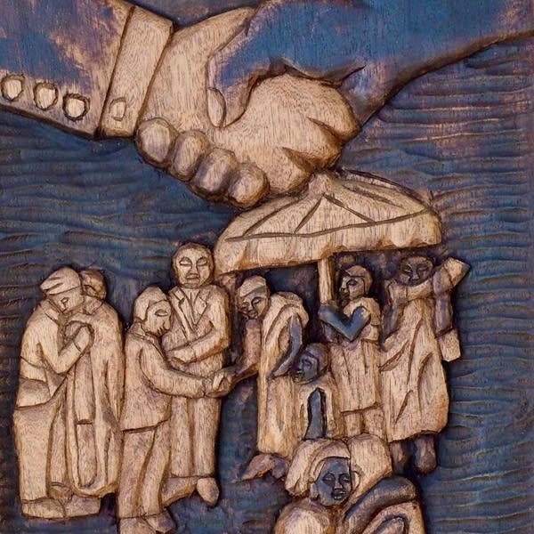 Artwork featuring a handshake and people gathered