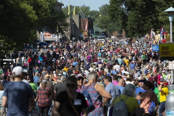 A crowd of people at the fair. 