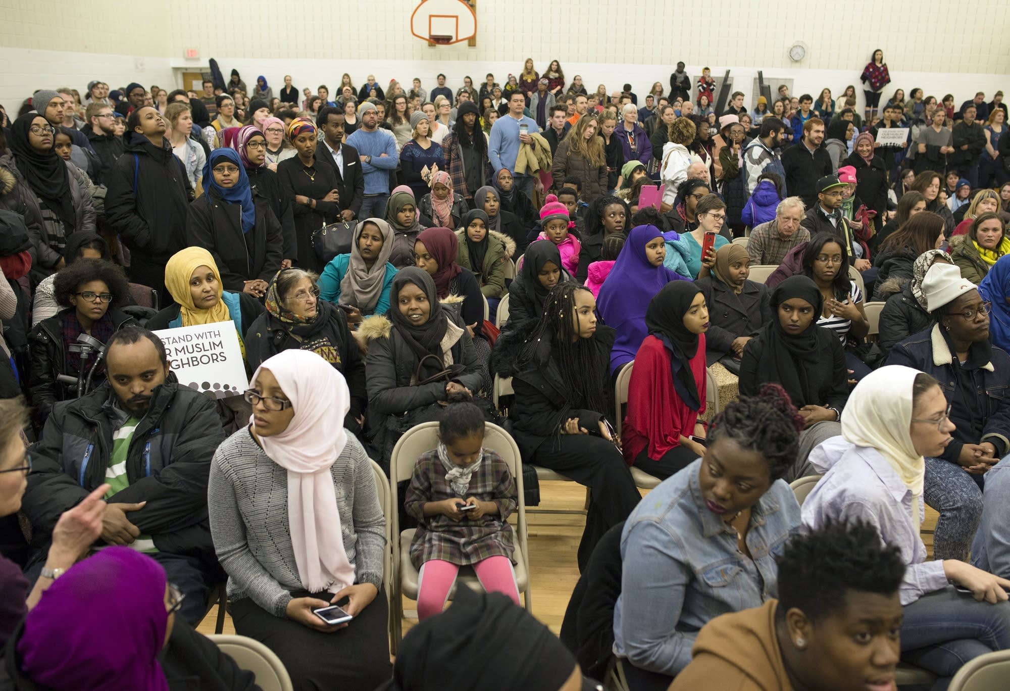 Hundreds pack the Brian Coyle Center Auditorium.