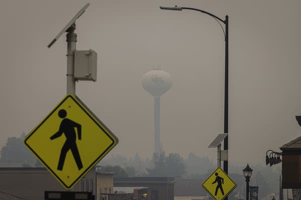 Smoke by a water tower