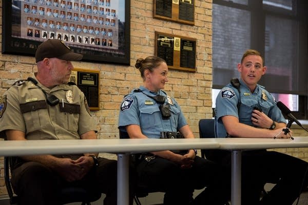 Officers speak about a water rescue.