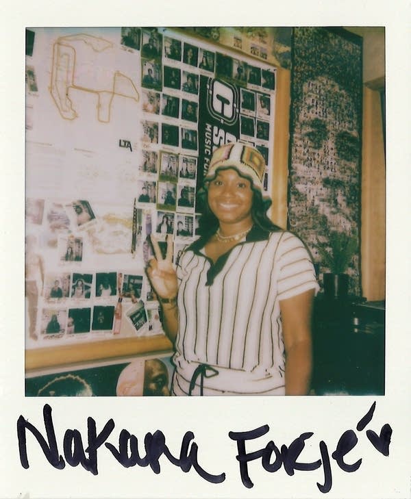 a signed polaroid with a woman in it