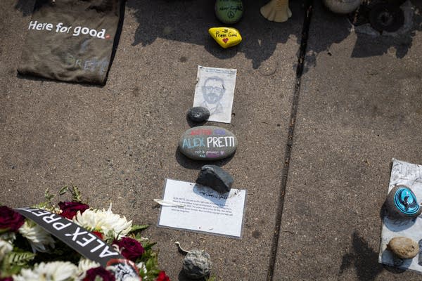 People visit a street memorial