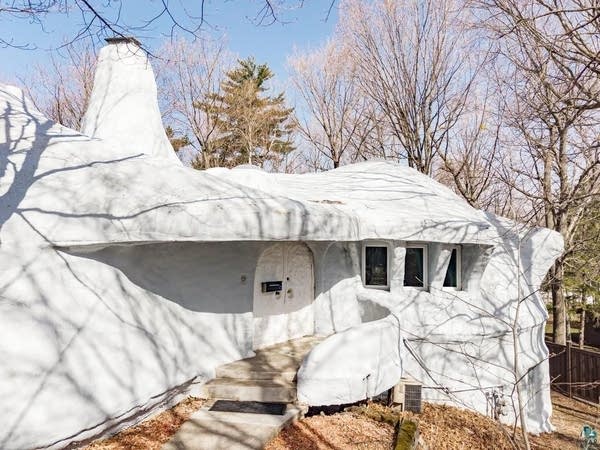 A white "Flintstone" shaped house for sale in Duluth.