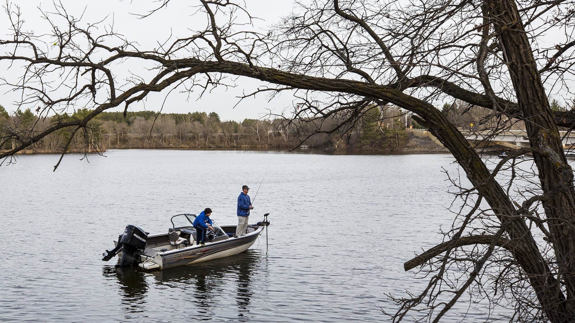 Jamie Revermann and his son Vince fish in Sartell