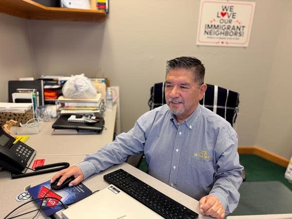 man sitting at desk in office