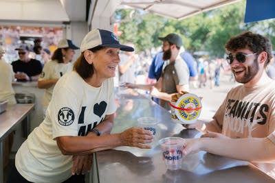 A person serves a guest milk