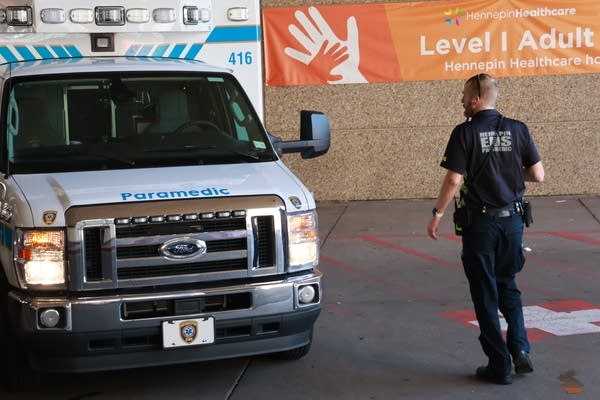 medic walks to ambulance at HCMC