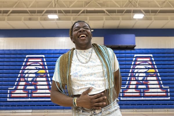 A person shares a light moment with the dancers