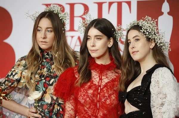 l-r: Este, Danielle, and Alana Haim at the BRIT Awards.