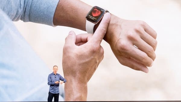 Apple COO Jeff Williams discusses Apple Watch Series 4 during an event on September 12, 2018, in Cupertino, California. The watch lets users take electrocardiogram readings. - New iPhones set to be unveiled Wednesday offer Apple a chance for fresh momentum in a sputtering smartphone market as the California tech giant moves into new products and services to diversify.Apple was expected to introduce three new iPhone models at its media event at its Cupertino campus, notably seeking to strengthen its position in the premium smartphone market a year after launching its $1,000 iPhone X.