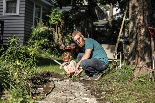 Madeleine Pfeiffer, 3, and her father, Andrew Bernhardt, create a path.