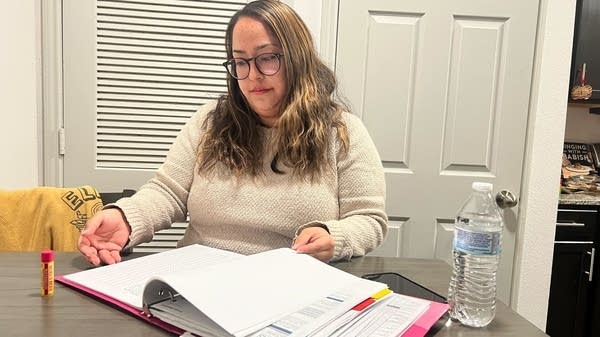 Ashley Ayala tracks her budget and expenses with a binder full of color-identified categories.