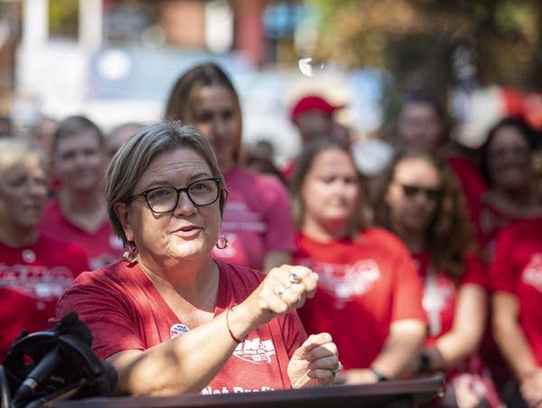 A woman speaks at a podium