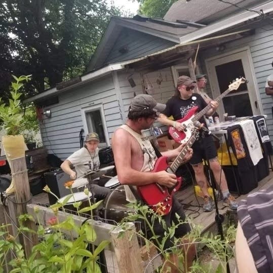 People play music on a porch