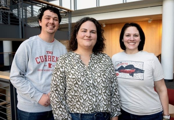 three people posing for a portrait