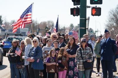 People stand and watch