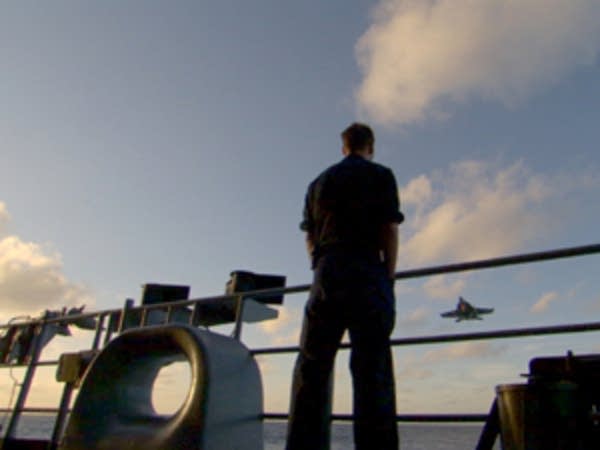 A sailor aboard the USS Nimitz.