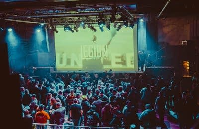 Legion of Lions graphic on screen and crowd