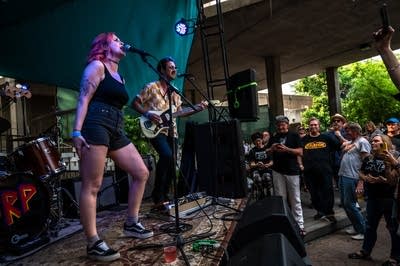 a band performing on an outdoor stage