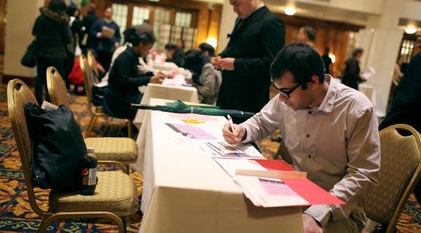 The Labor Department reports the economy added 120,000 jobs last month, and the unemployment rate dropped to 8.2 percent. It was a disappointment compared to expectations. Here, a job seeker fills out a job application in San Francisco, Calif.