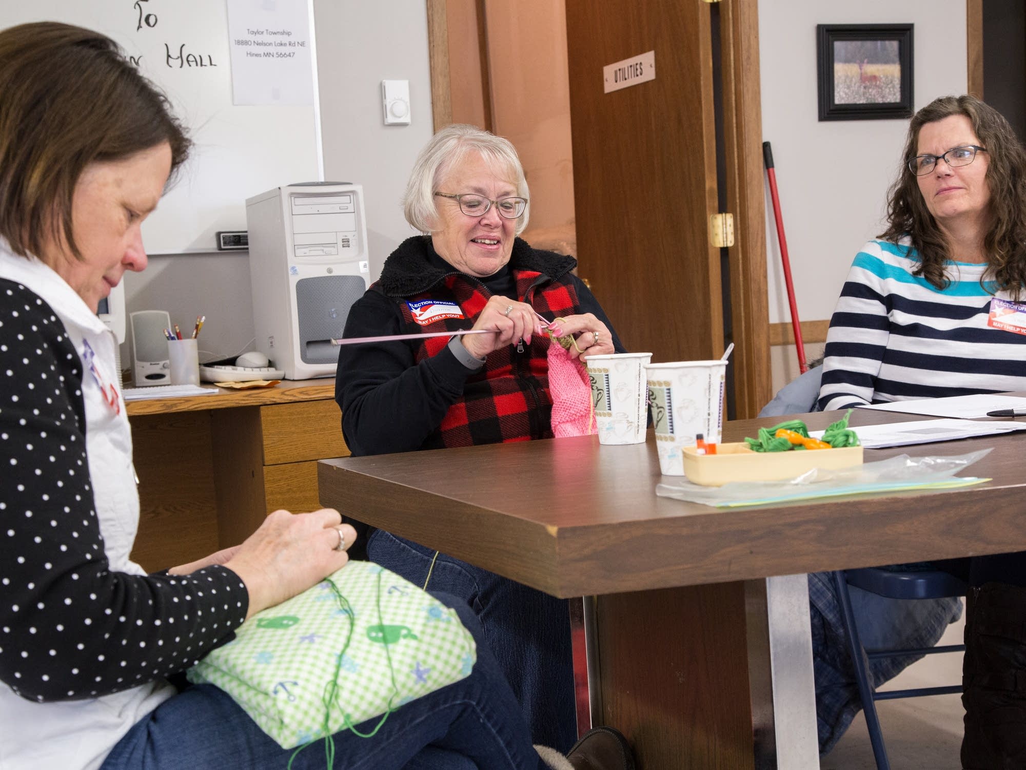 Joanne Barfknecht makes blankets while Dianne Sizer knits.