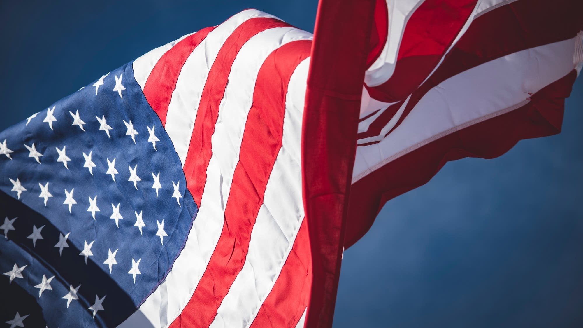 A U.S. flag waves in the breeze.