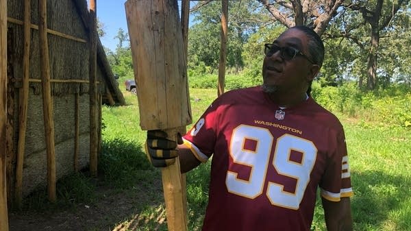 Sam Wells holds a traditional hammer