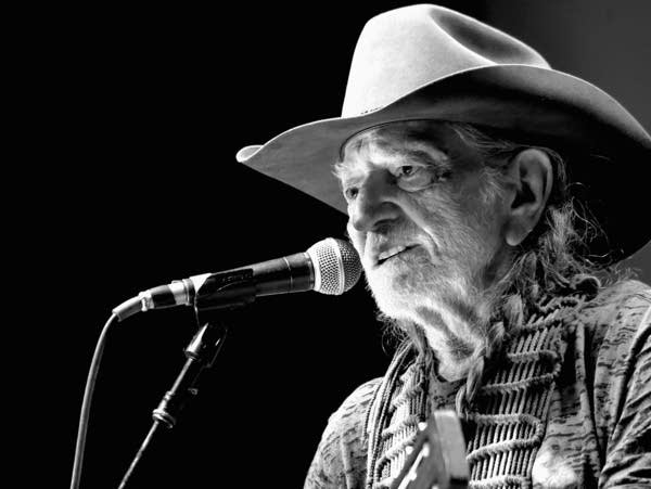 NASHVILLE, TN - MARCH 16: (EDITORS NOTE: This image has been converted to black and white) Willie Nelson performs at The Life & Songs of Kris Kristofferson produced by Blackbird Presents at Bridgestone Arena on March 16, 2016 in Nashville, Tennessee.