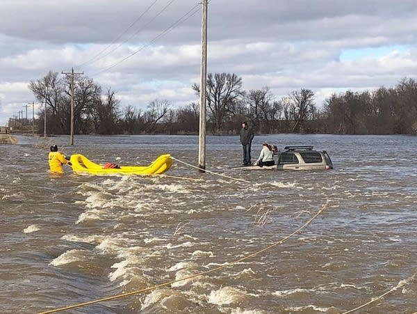 Lac qui Parle County sheriff's deputies rescue the occupants of an SUV