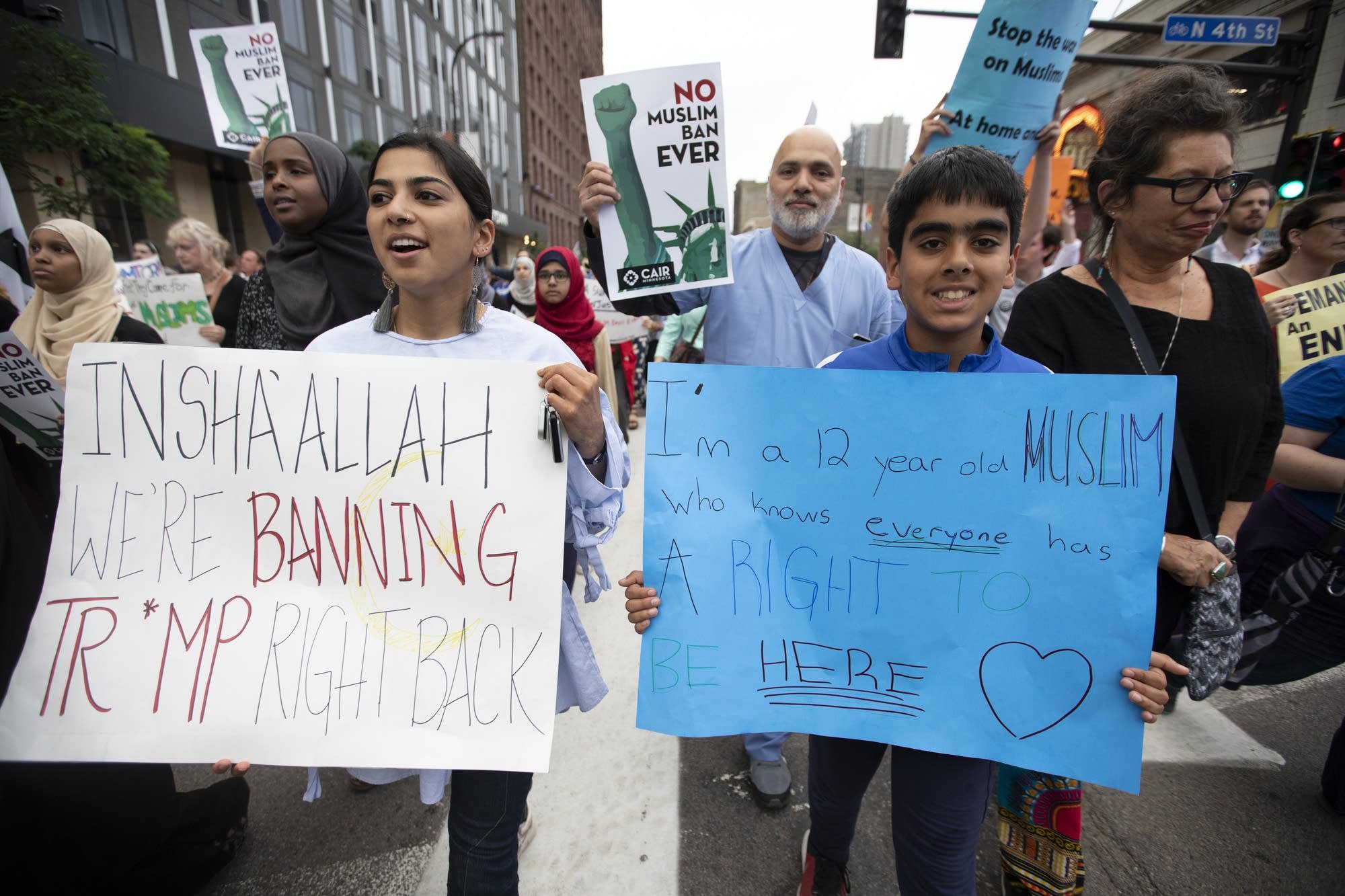 Protesters in Minneapolis march against President Trump's travel ban.