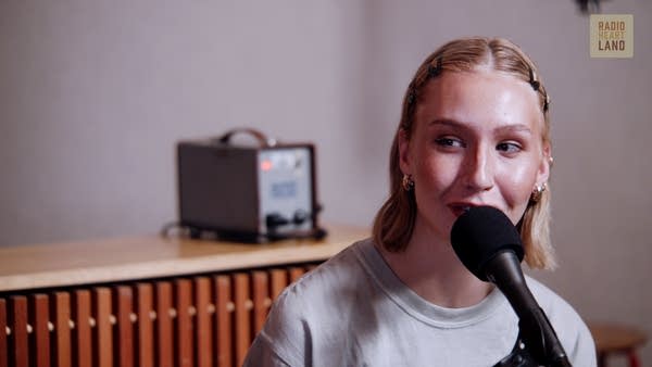 A musician converses with a radio host