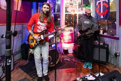 Band performing by window