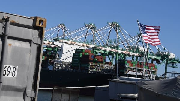Shipping containers from China and other nations are unloaded at the Long Beach Port in Los Angeles in February. 