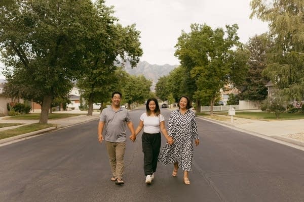 Dennis Urabe and Bo Thao-Urabe with their daughter