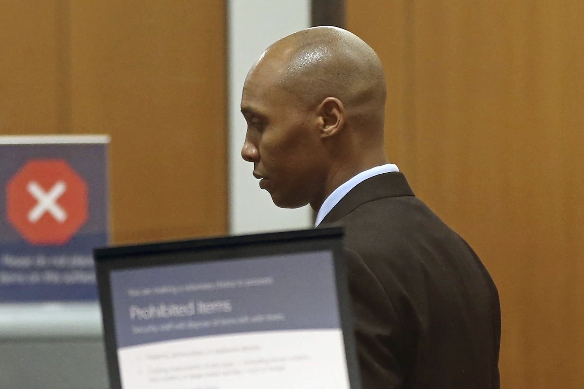 Former Minneapolis police officer Mohamed Noor goes through security.