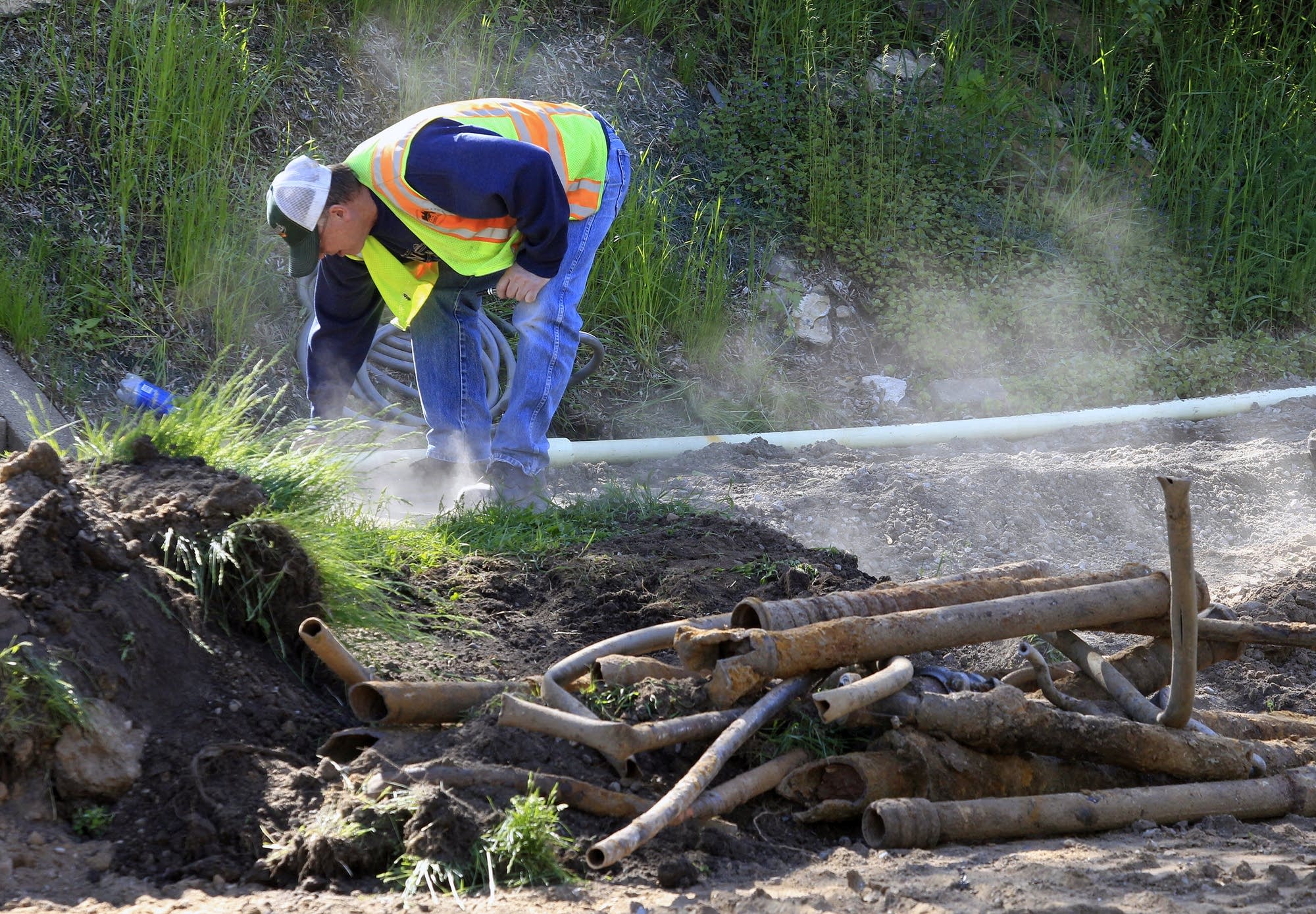 Tearing up the streets to replace pipes.