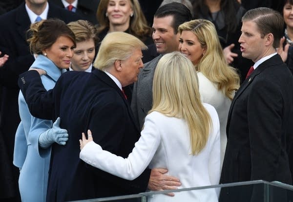 President Donald Trump hugs his family.