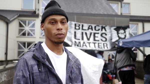 Black Lives Matter demonstrators dig in at Mpls. police precinct, undeterred by rain, cold