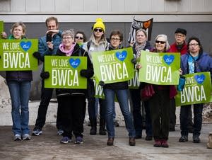 A group of people opposed to the Twin Metals project hold a banner