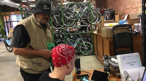 Joi Roboch signs Dino Lombardo up for the Pittsburgh Bike Share program at the organization's office. 