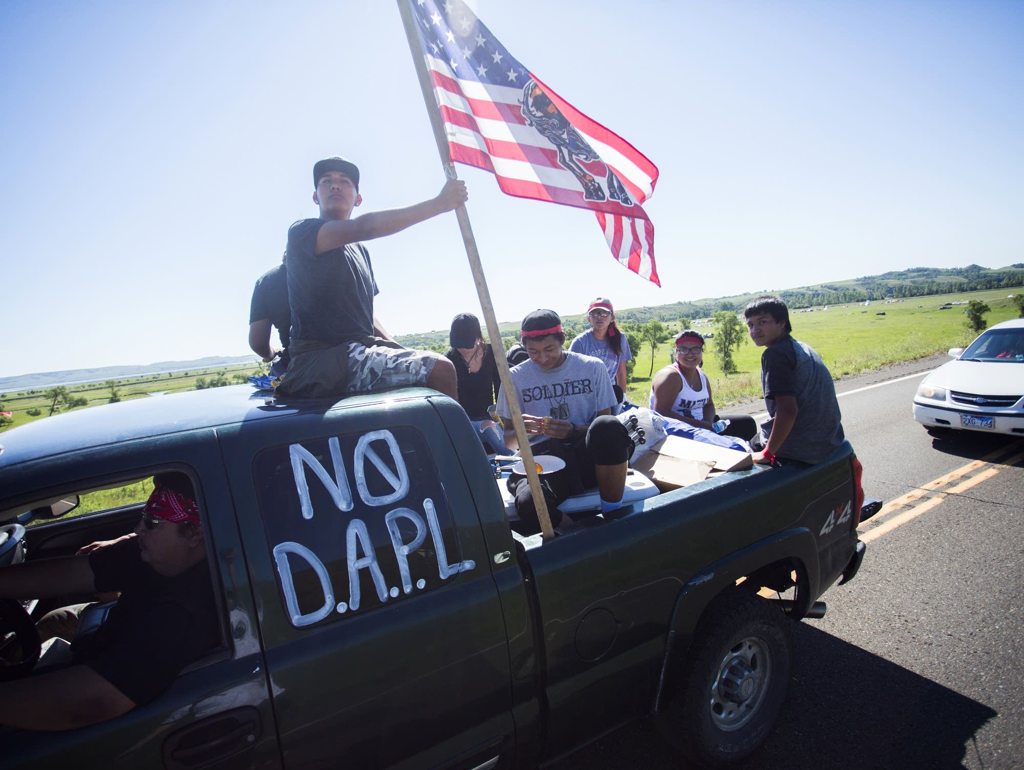 A car full of young people leave the camp.