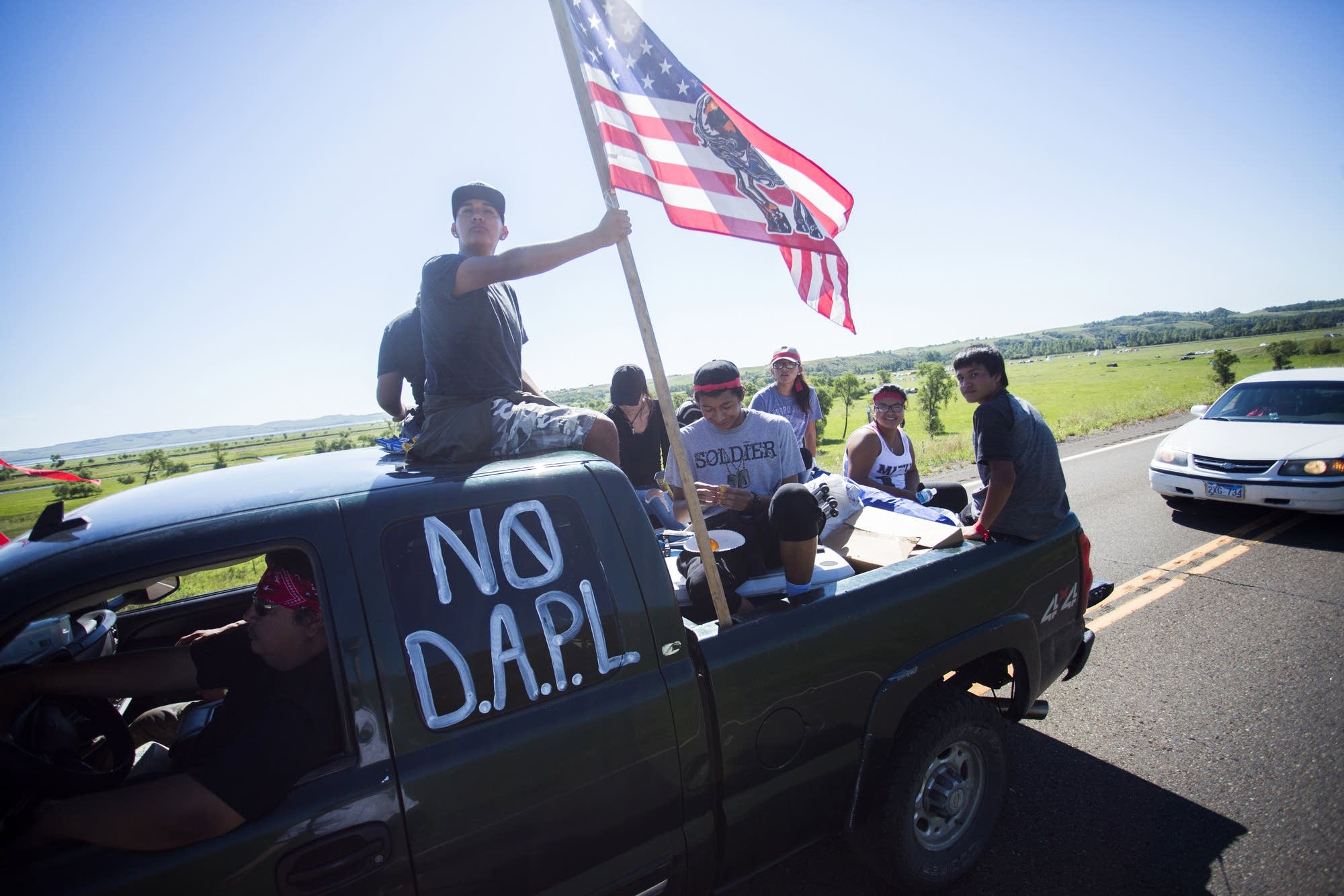 A car full of young people leave the camp.