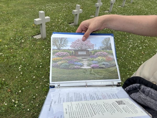 A binder shows plans for a new garden.