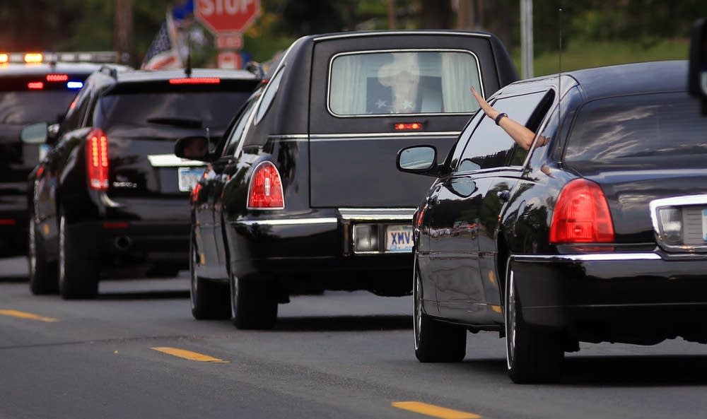 Officer Patrick's wife waves.