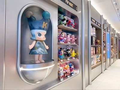 Dolls displayed along wall