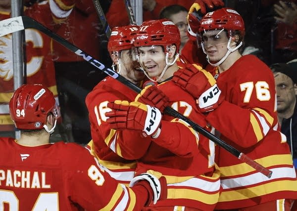Flames beat Minnesota 4-2 to prevent the Wild from clinching a playoff spot 