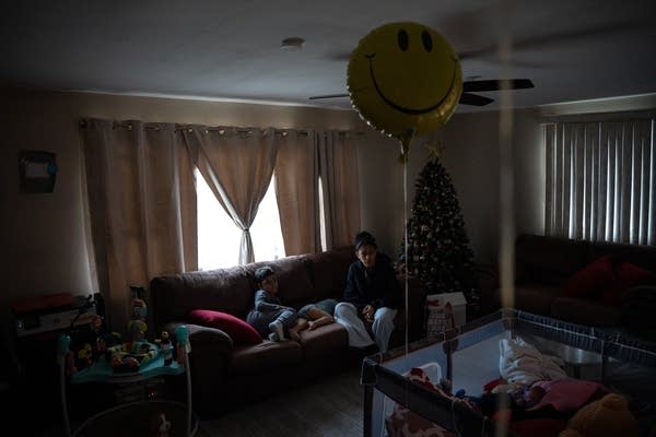 people sit in house with balloon
