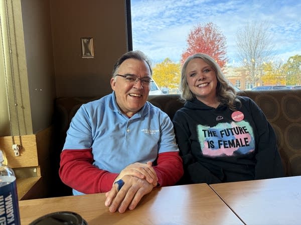 Two people pose for a photo