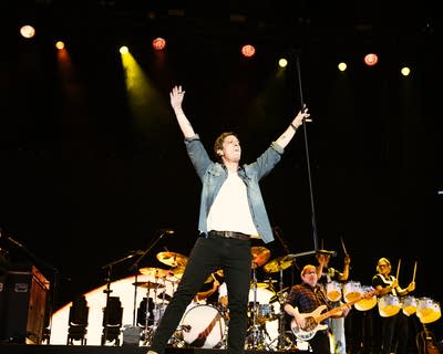 the band matchbox twenty performing at an outdoor music festival at night